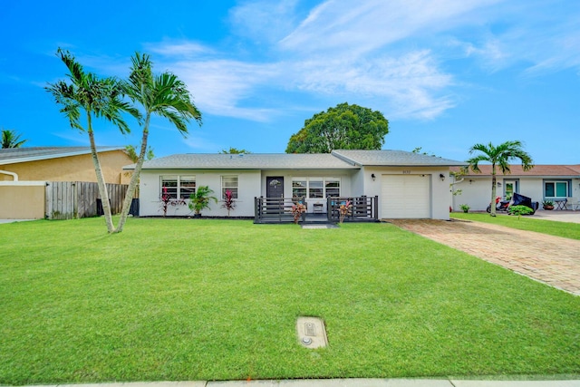 ranch-style house with a front yard and a garage