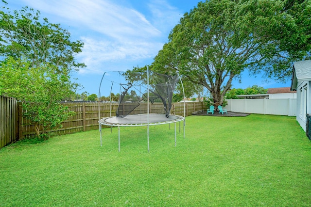 view of yard featuring a trampoline