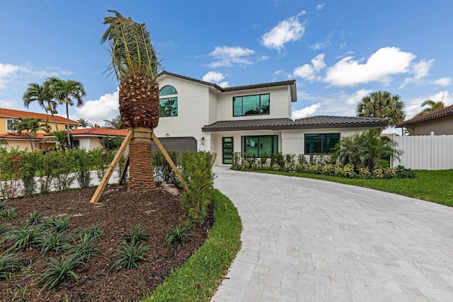 mediterranean / spanish house featuring a garage