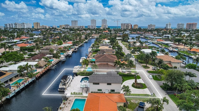 birds eye view of property with a water view