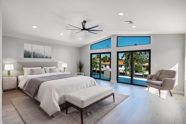 bedroom with lofted ceiling, french doors, ceiling fan, access to exterior, and light wood-type flooring