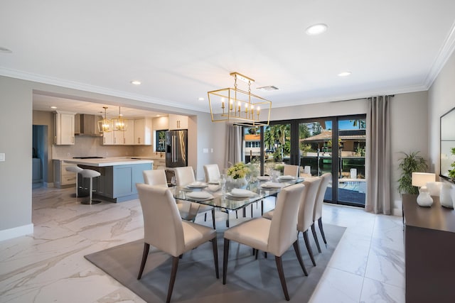 dining area featuring a notable chandelier and crown molding