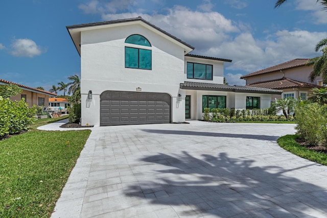 mediterranean / spanish house with a garage