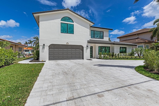 mediterranean / spanish home with a garage