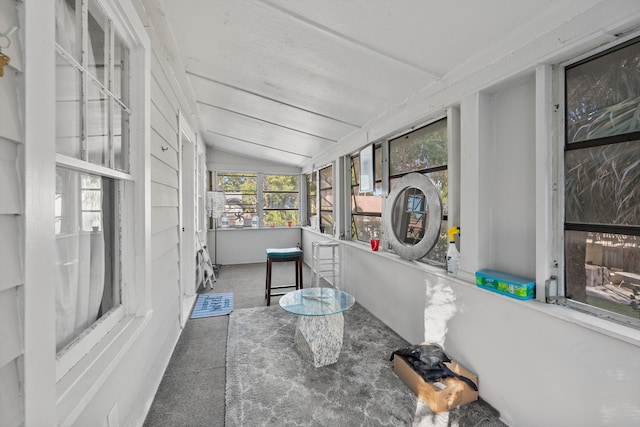 sunroom / solarium with vaulted ceiling