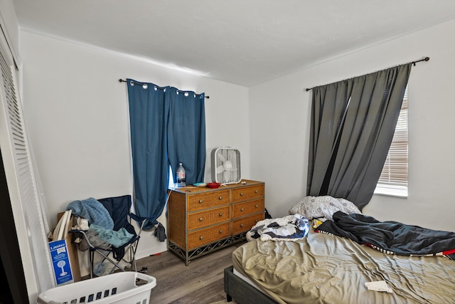 bedroom with hardwood / wood-style floors