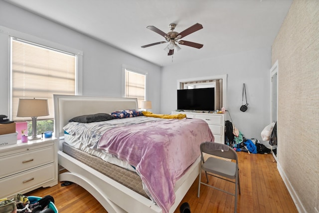 bedroom featuring ceiling fan and light wood-type flooring