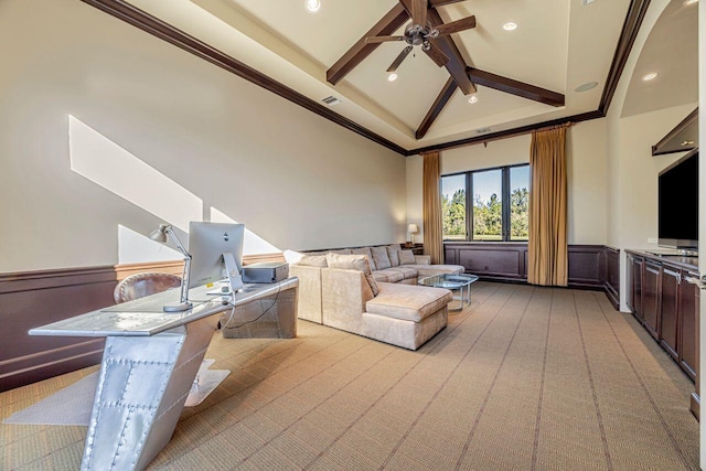 carpeted living room featuring lofted ceiling with beams, ceiling fan, and crown molding