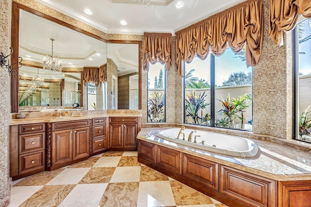 bathroom featuring a bathing tub, an inviting chandelier, crown molding, a tray ceiling, and vanity