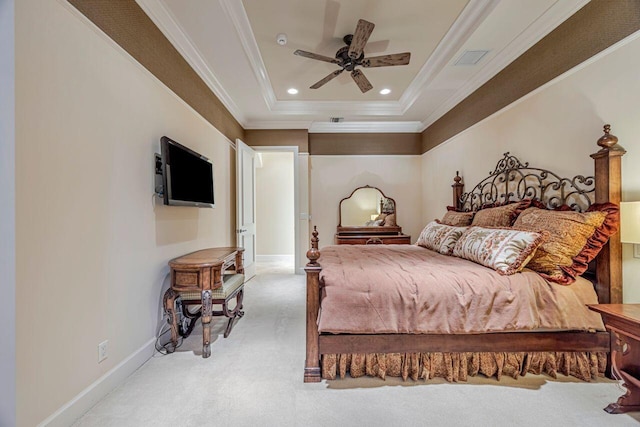 bedroom with light colored carpet, crown molding, ceiling fan, and a tray ceiling