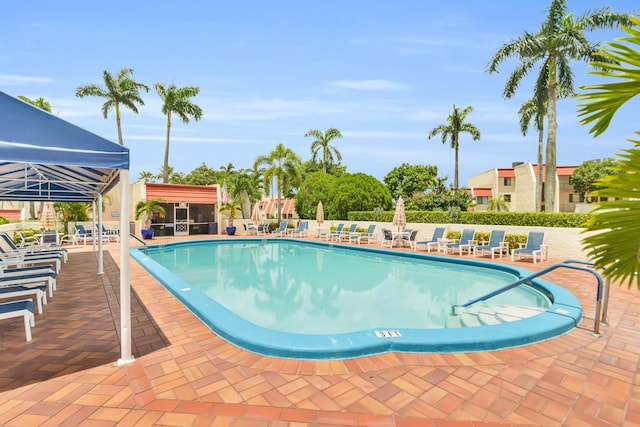 view of swimming pool with a patio