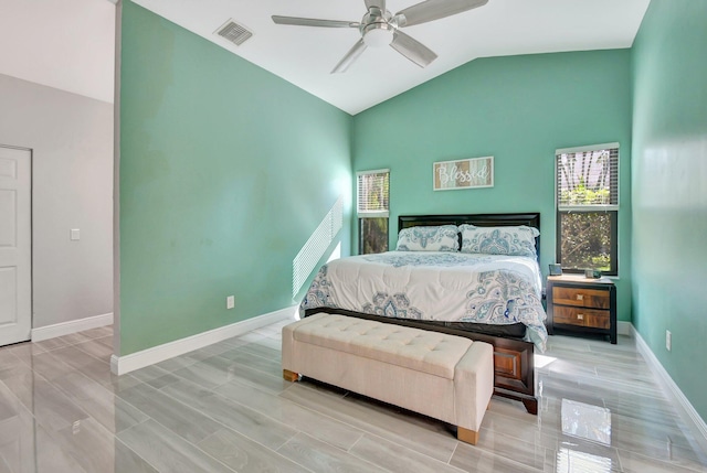 bedroom with light hardwood / wood-style flooring, ceiling fan, and lofted ceiling