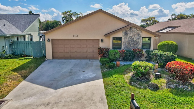 view of front of house featuring a front lawn and a garage