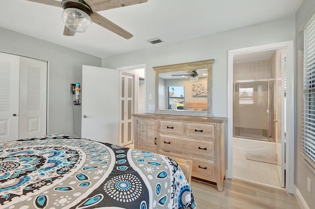 bedroom with a closet, ensuite bathroom, ceiling fan, and light hardwood / wood-style floors