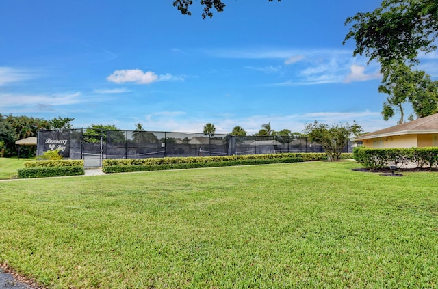 view of yard with tennis court