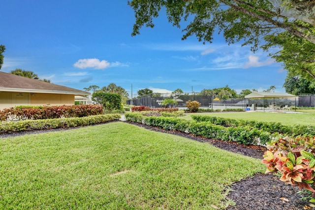 view of yard with tennis court