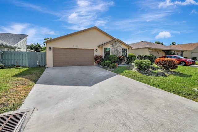 single story home with a front yard and a garage