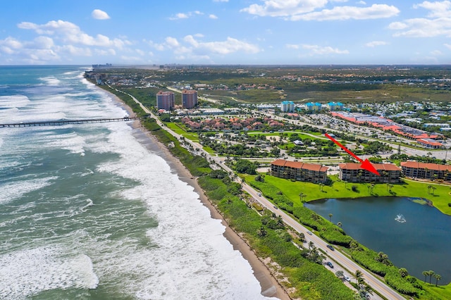 bird's eye view featuring a water view and a view of the beach