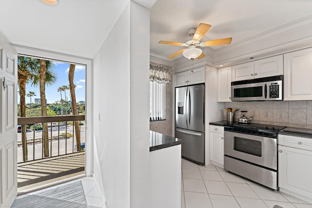 kitchen featuring white cabinetry, plenty of natural light, and stainless steel appliances