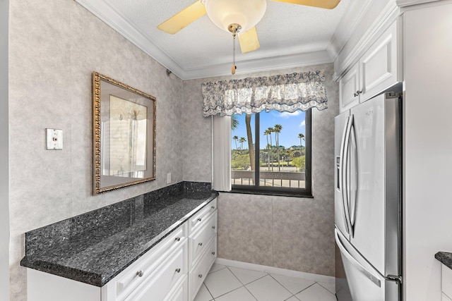 kitchen with stainless steel fridge with ice dispenser, crown molding, white cabinets, and ceiling fan