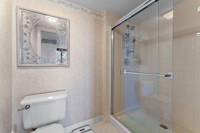 bathroom featuring toilet, tile patterned flooring, and walk in shower