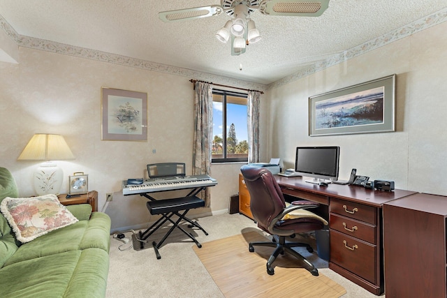 carpeted office space with a textured ceiling and ceiling fan