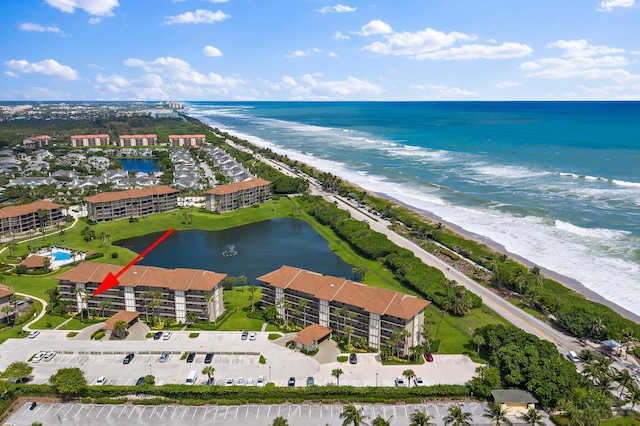 drone / aerial view with a view of the beach and a water view