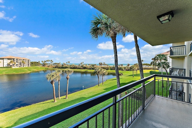 balcony featuring a water view