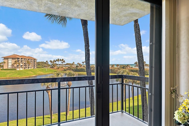 balcony featuring a water view