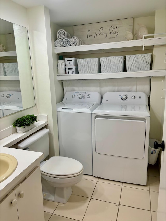 interior space featuring light tile patterned floors and washing machine and clothes dryer