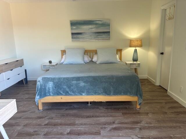 bedroom featuring dark hardwood / wood-style floors