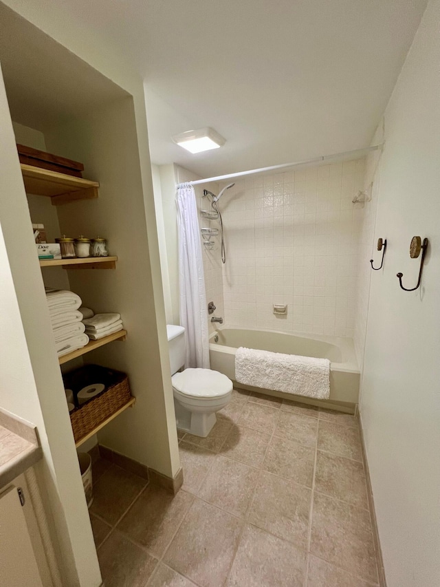 full bathroom with tile patterned floors, vanity, toilet, and shower / bath combo with shower curtain