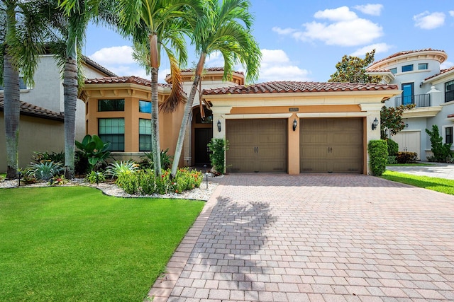 mediterranean / spanish home featuring a front yard