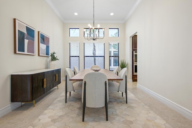 tiled dining area with a chandelier, a towering ceiling, and crown molding