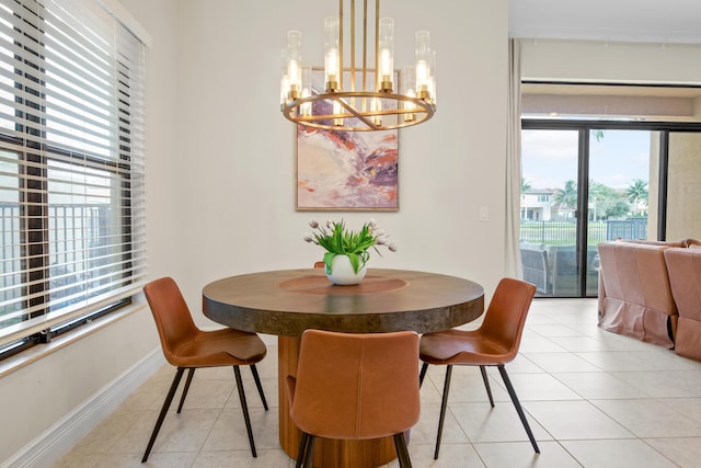 dining space featuring a notable chandelier and light tile patterned floors