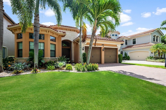 mediterranean / spanish-style home with a front yard