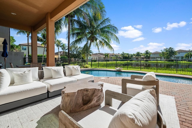 view of swimming pool with an outdoor living space and a patio