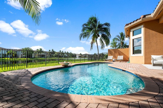 view of swimming pool with a patio area