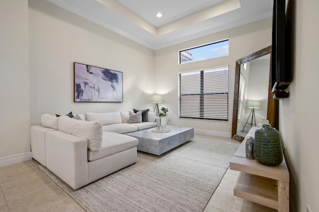 living room featuring light tile patterned floors, crown molding, and a high ceiling