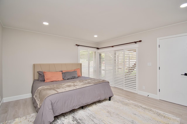 bedroom with light hardwood / wood-style floors