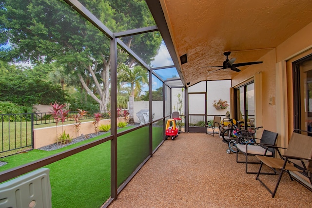 sunroom featuring plenty of natural light and ceiling fan