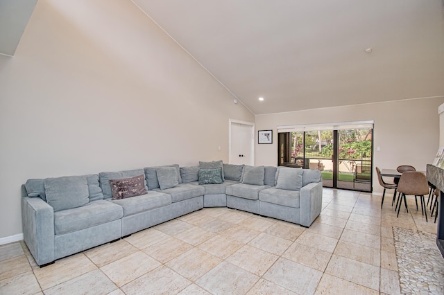 living room with high vaulted ceiling