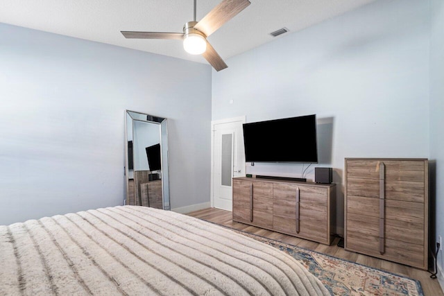 bedroom featuring ceiling fan and light wood-type flooring