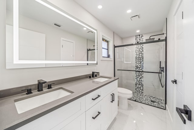 bathroom with toilet, an enclosed shower, and vanity