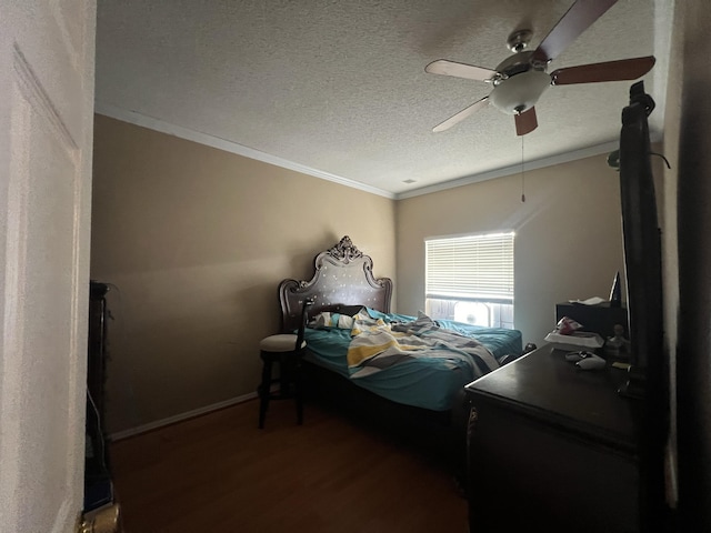 bedroom with a textured ceiling, ceiling fan, crown molding, and dark wood-type flooring