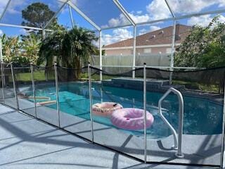 view of pool featuring a lanai