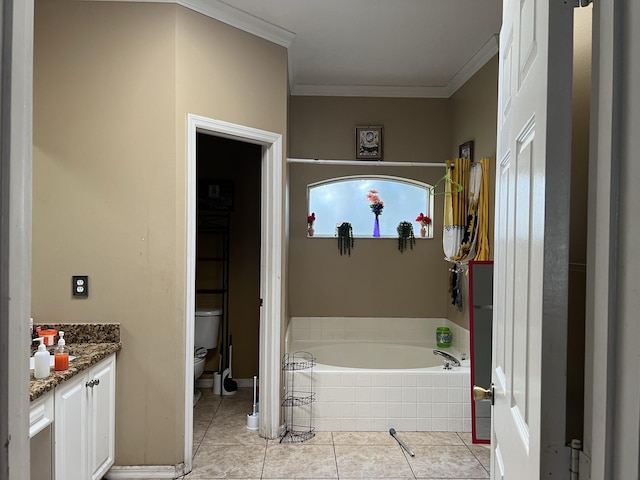 bathroom featuring vanity, crown molding, tiled tub, tile patterned flooring, and toilet