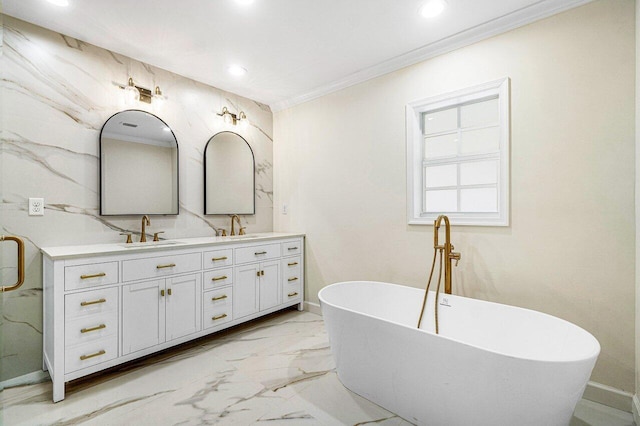 bathroom with vanity, a bathtub, and crown molding