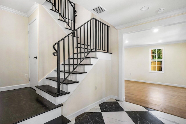 stairs with hardwood / wood-style floors and ornamental molding