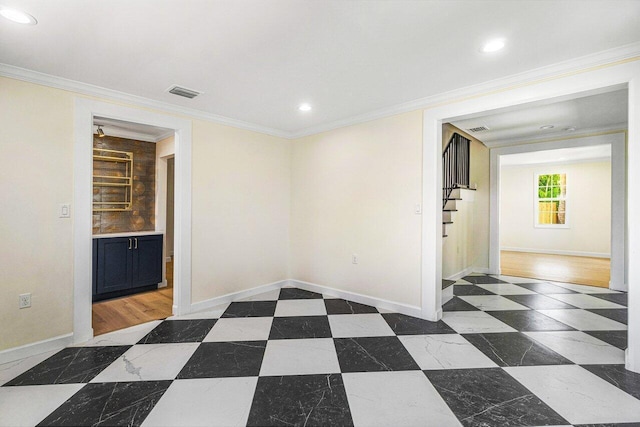 empty room featuring dark hardwood / wood-style flooring and ornamental molding